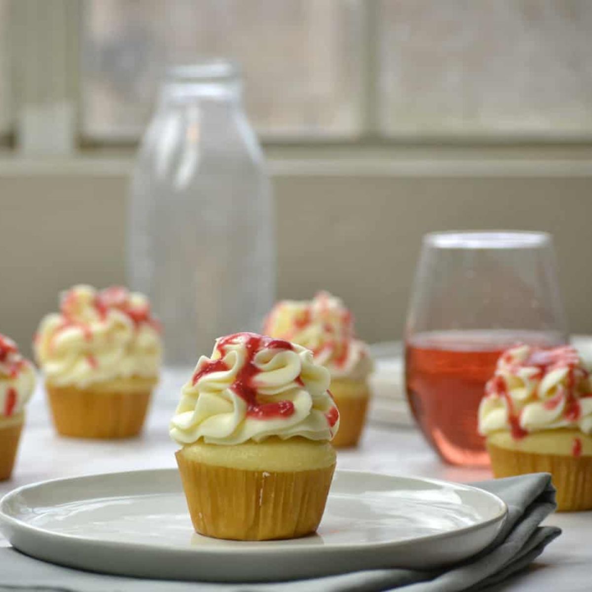 Pink Champagne Cupcakes With A Strawberry Compote Filling - The Art of Baking