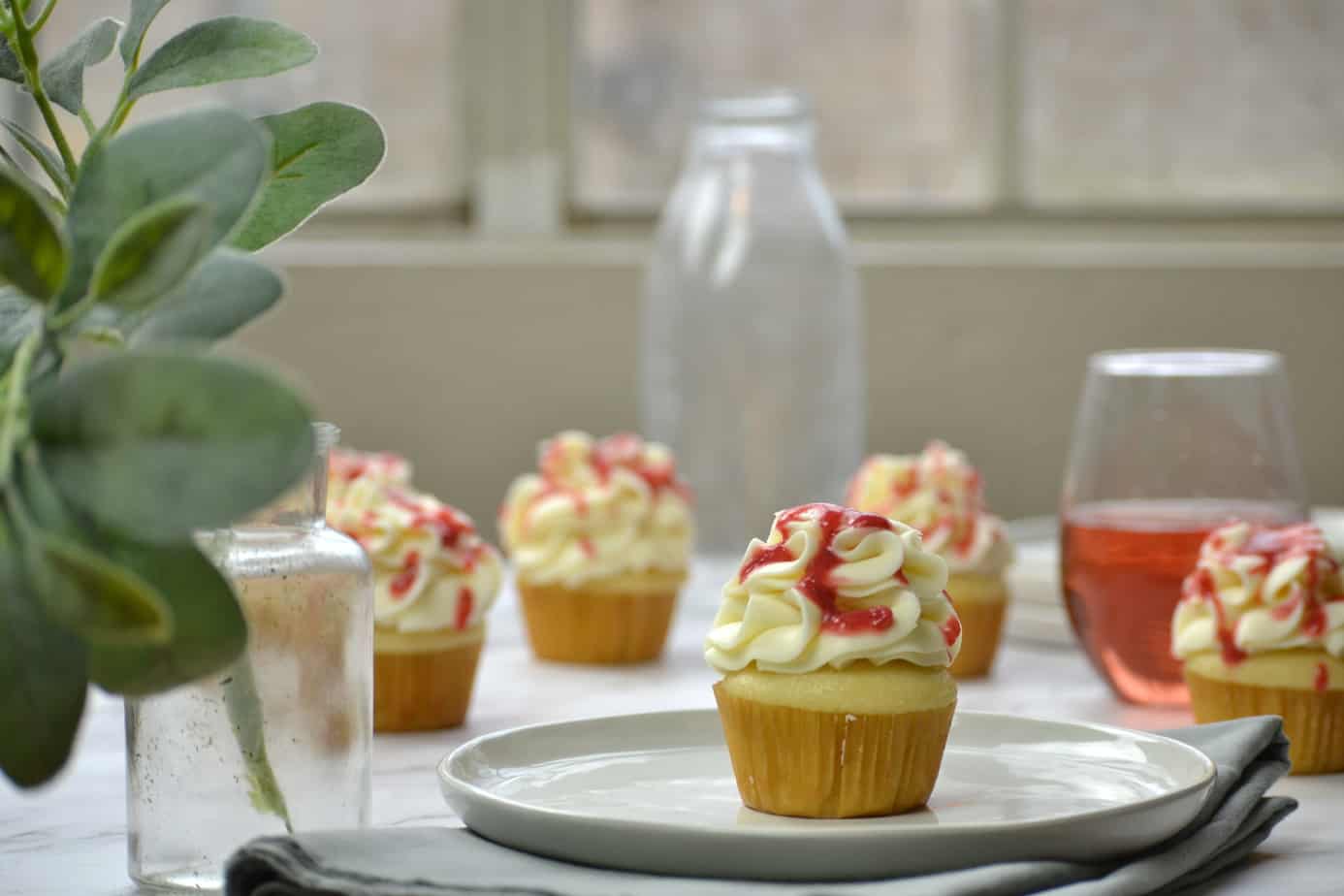 PInk champagne cupcakes on table