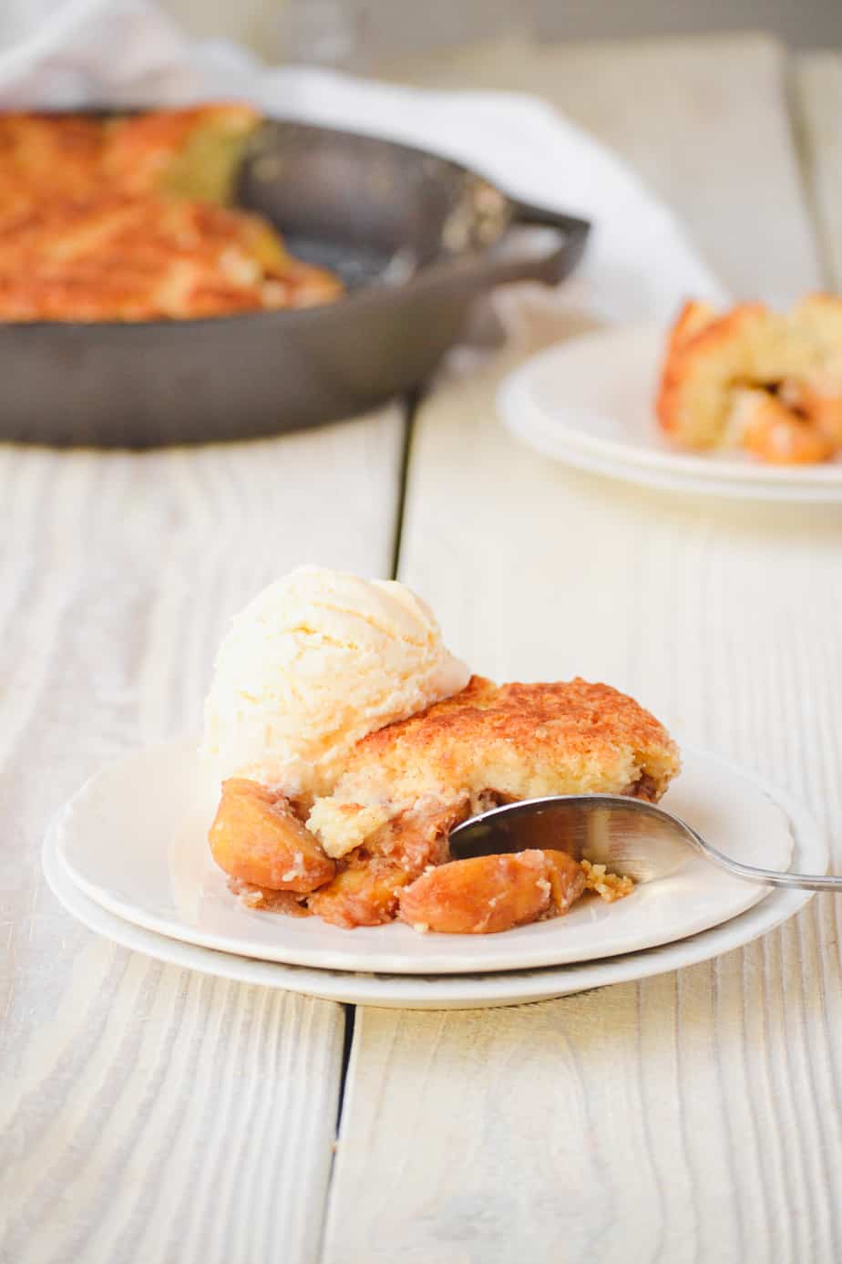 Cast iron skillet peach cobbler. In 12 inch cast iron skillet melt 1 stick  butter, add 4 - 15 oz cans peaches with s…