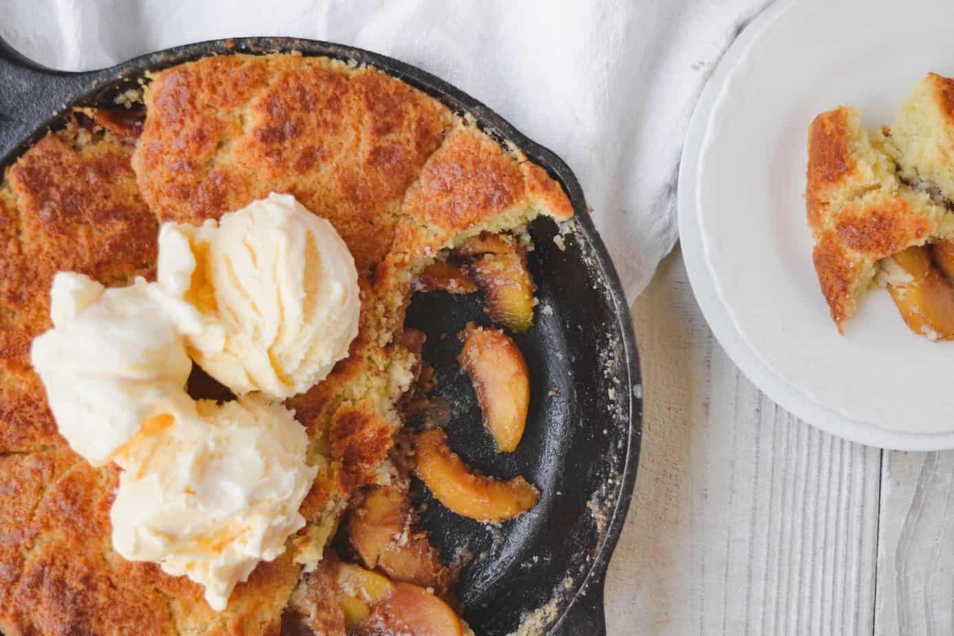 Cast iron skillet peach cobbler. In 12 inch cast iron skillet melt 1 stick  butter, add 4 - 15 oz cans peaches with s…