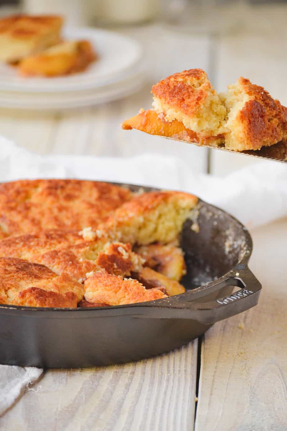 peach cobbler in a cast iron skillet