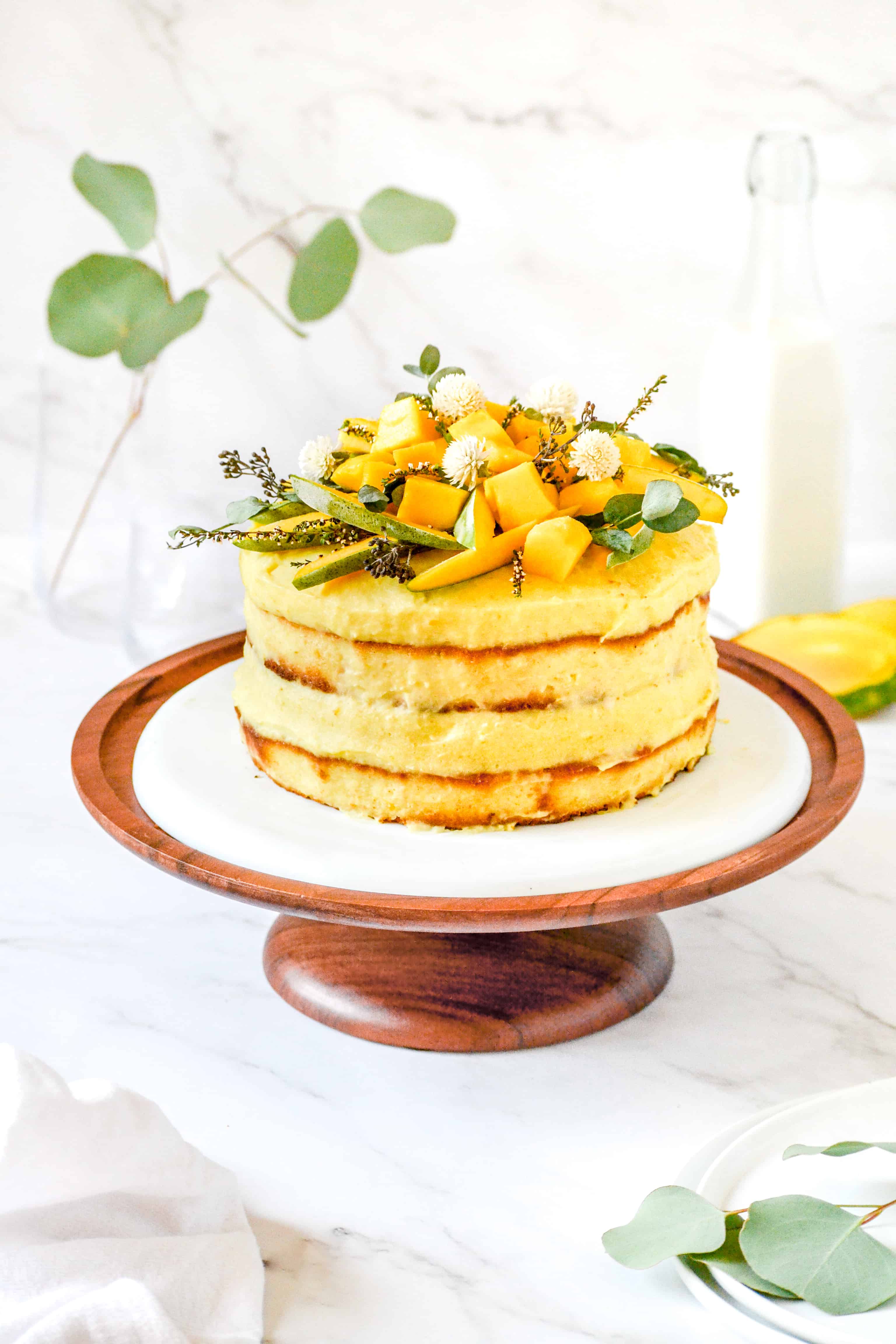 MANGO MOUSSE CAKE placed on a cake stand