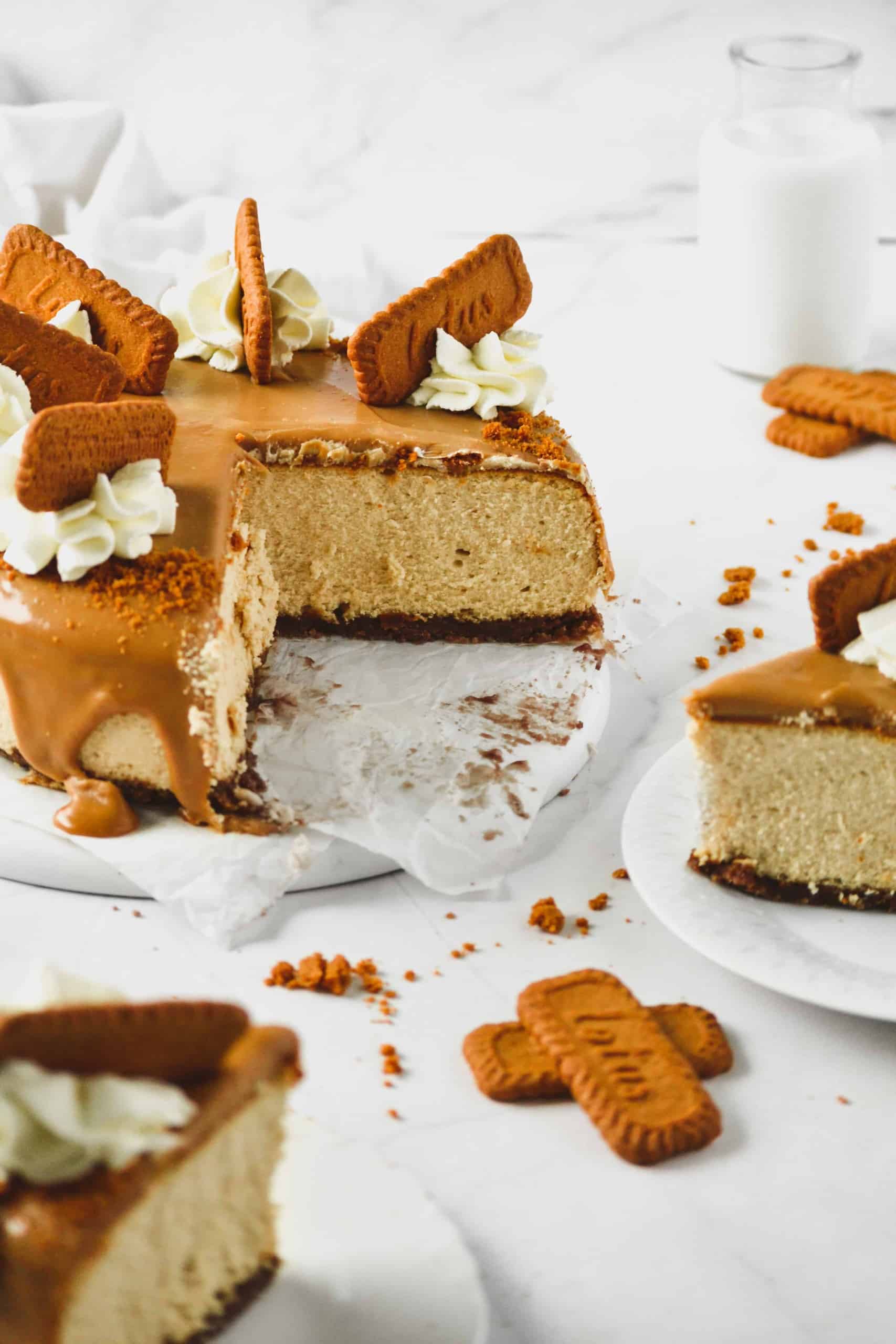 Sliced biscoff cheesecake with cookie crust.